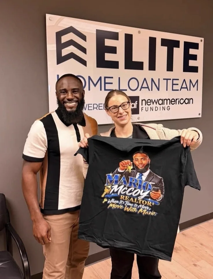 Mario with a buyer holding a Mario McCoy shirt
